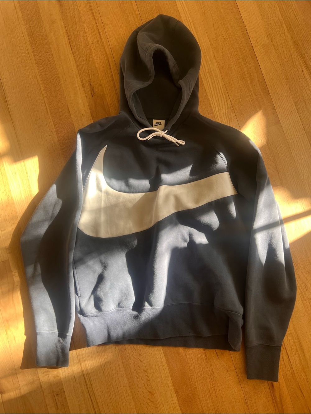 Nike Men's Navy Hoodie with Large Cream Swoosh